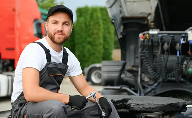Diesel tech working on a semi tractor